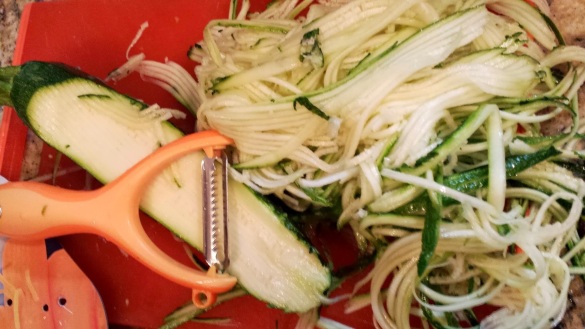 A big pile of Zucchini "noodles" from 1 medium sized Zucchini.