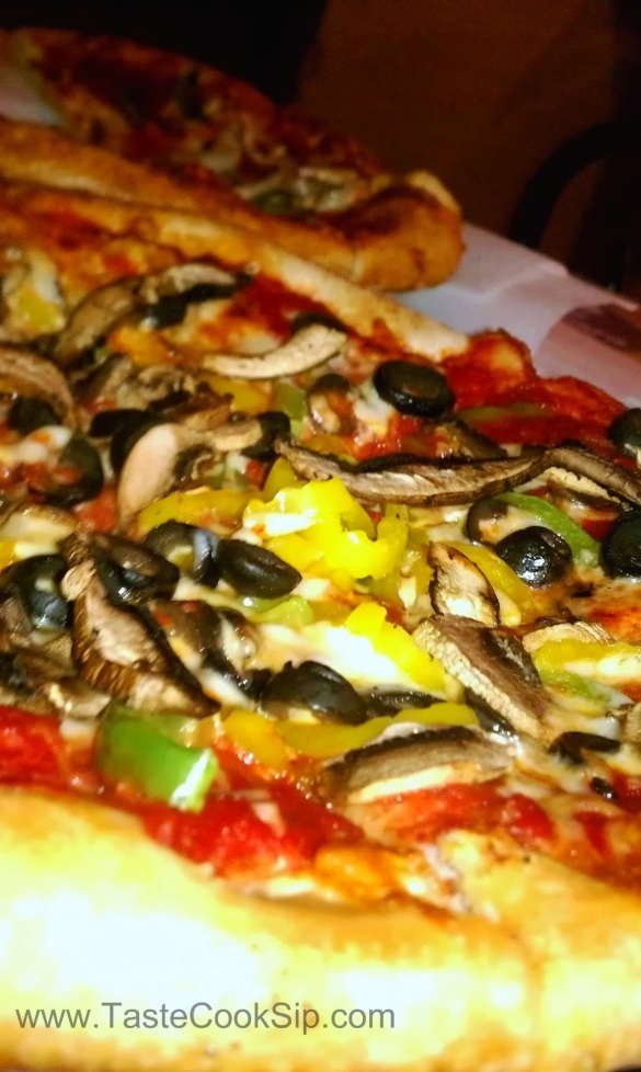 Nice selections of veggies on the veggie pizza. Hold the onions, please.